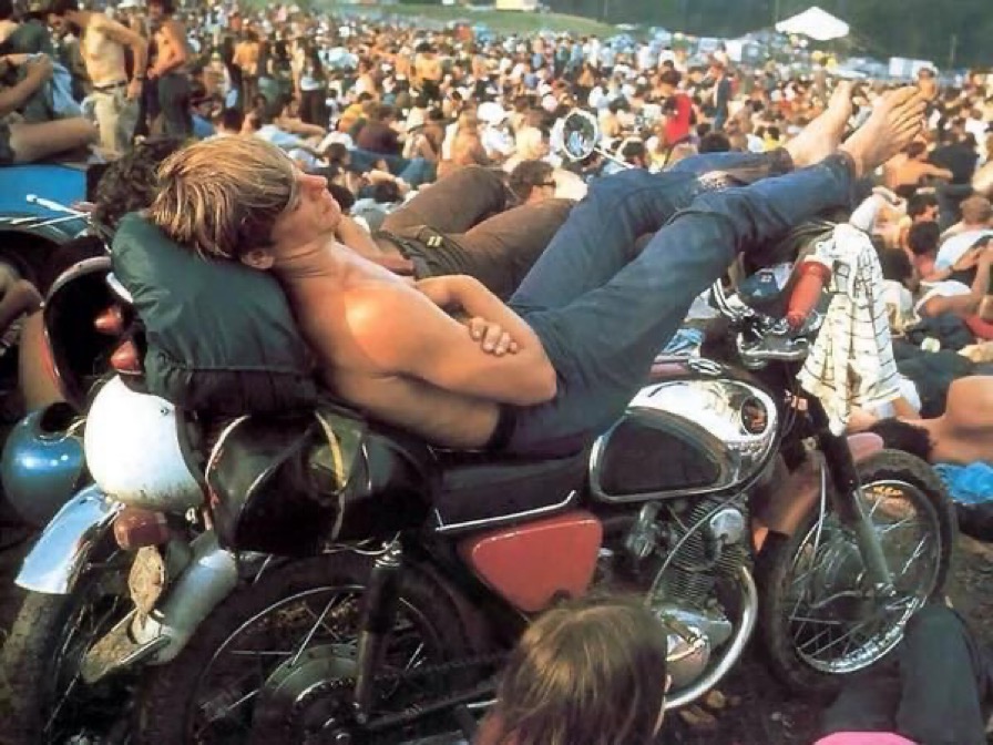 Man Sleeps on Motorcycle during Woodstock, 1969