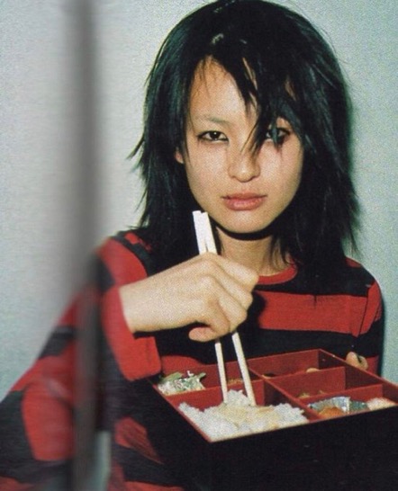 A Model Eating Backstage at the Undercover A/W 1997 Show